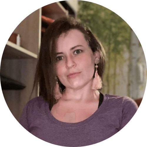 A woman sitting in her office chair smiling