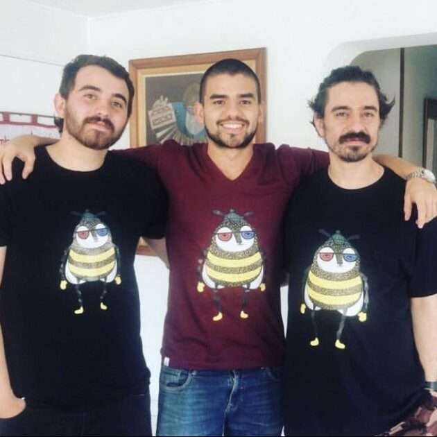 Three men wearing matching Beeco T-shirts