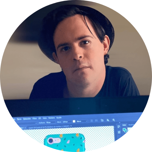 A person with Down Syndrome posing in front of a camera with a computer screen showing a product design based on his drawings of birds